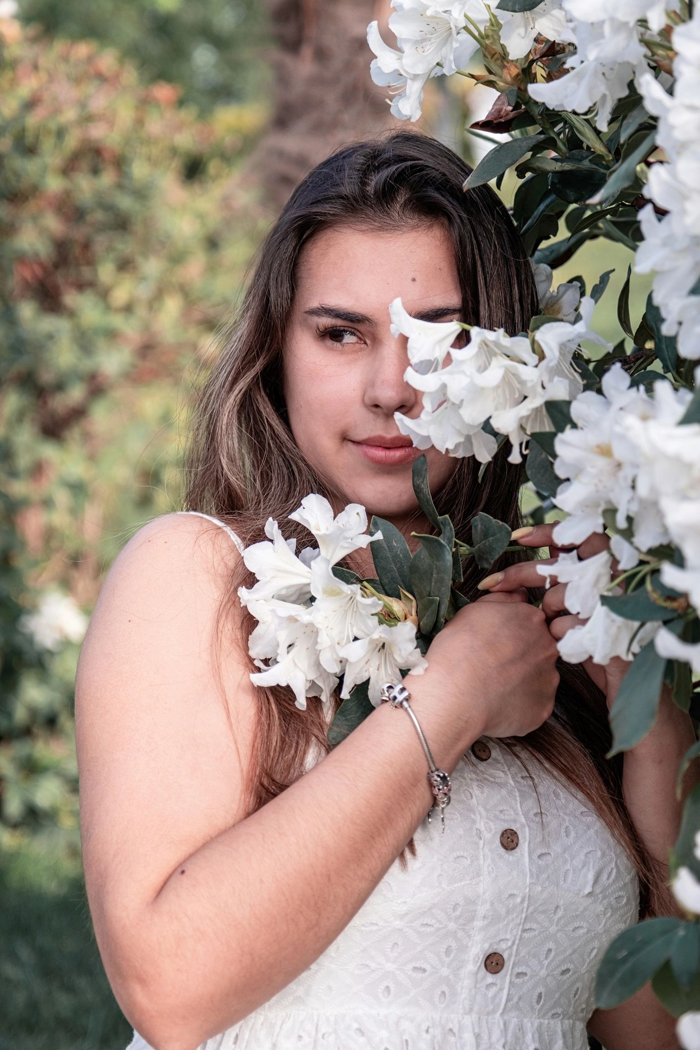 Soft portrait-style image surrounded by white blossoms